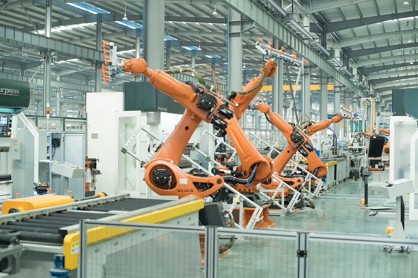 Industrial robotic arms in an automated bending process